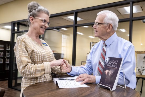 Robinson donates autographed copy of new book to Bennett Library Thumbnail