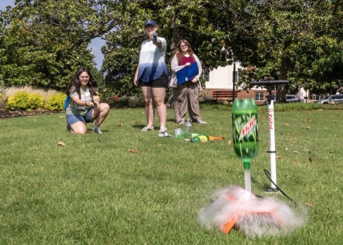 Students watching a water rocket 