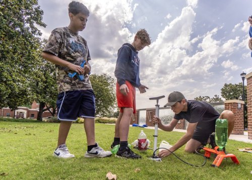 Students setting up a device