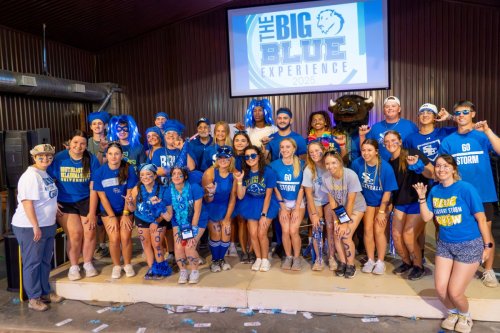Big Group photo of students in blue