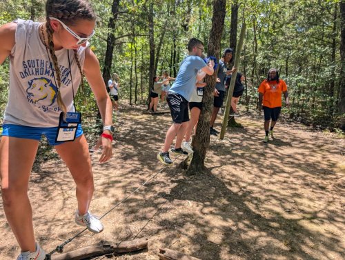 Students doing a ropes course
