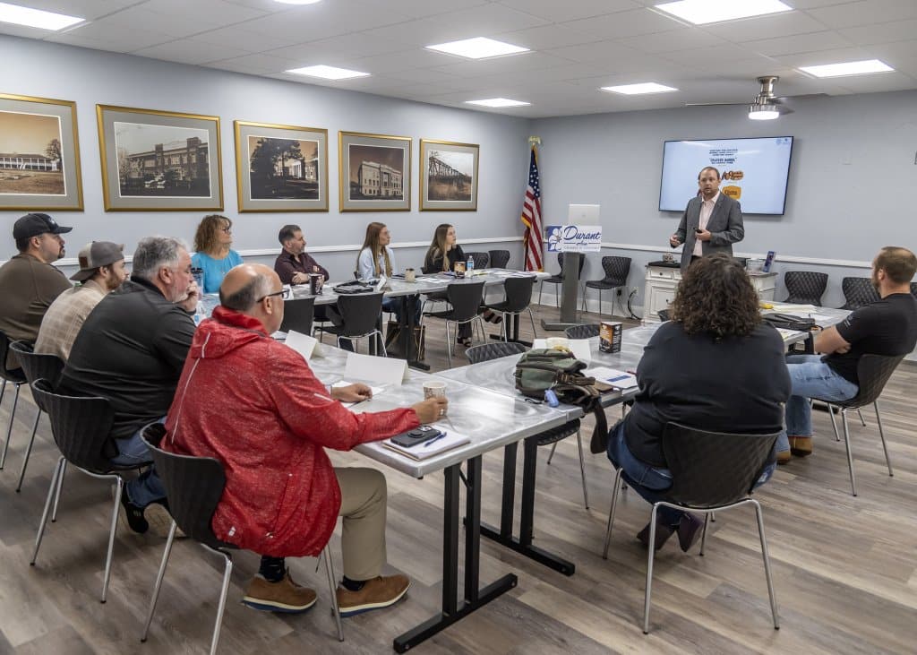 Dr. Eric Kennedy speaking in a classroom setting at the Durant Area Chamber of Commerce