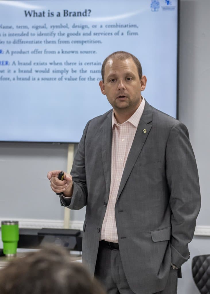 Dr. Eric Kennedy speaking in a classroom setting at the Durant Area Chamber of Commerce