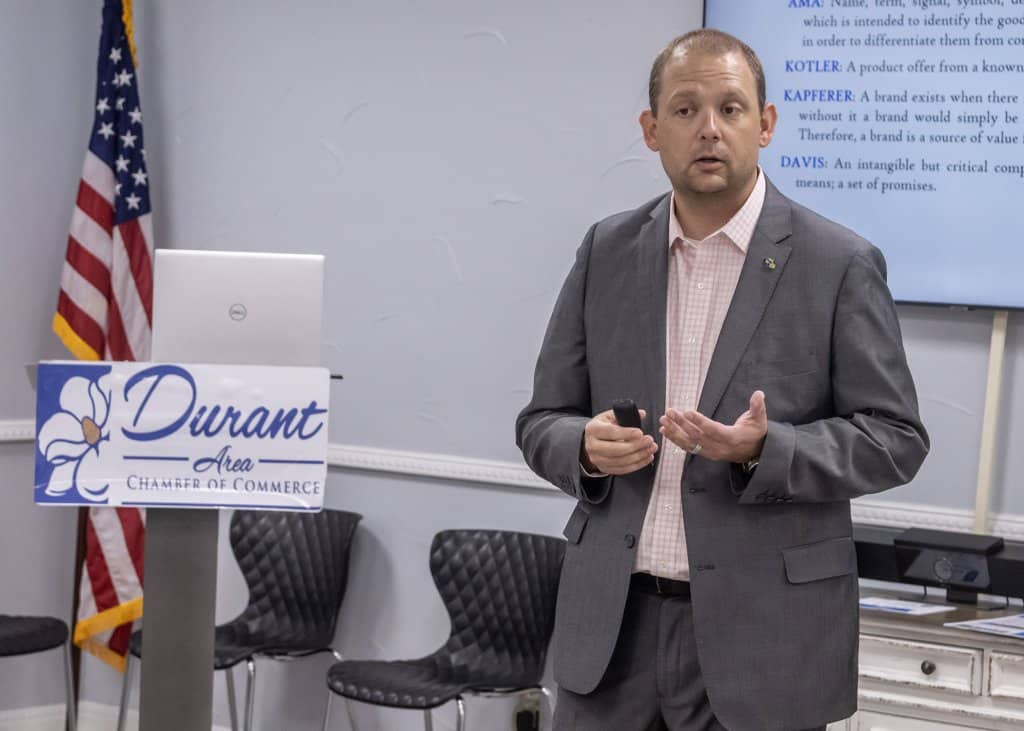 Dr. Eric Kennedy speaking in a classroom setting at the Durant Area Chamber of Commerce