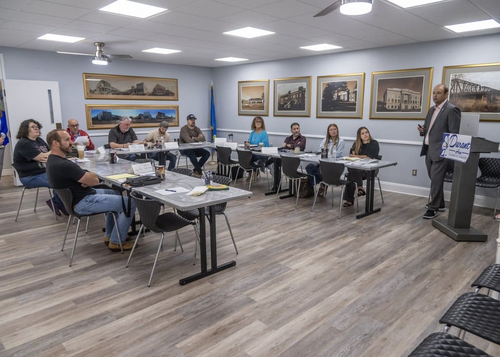 Dr. Eric Kennedy speaking in a classroom setting at the Durant Area Chamber of Commerce