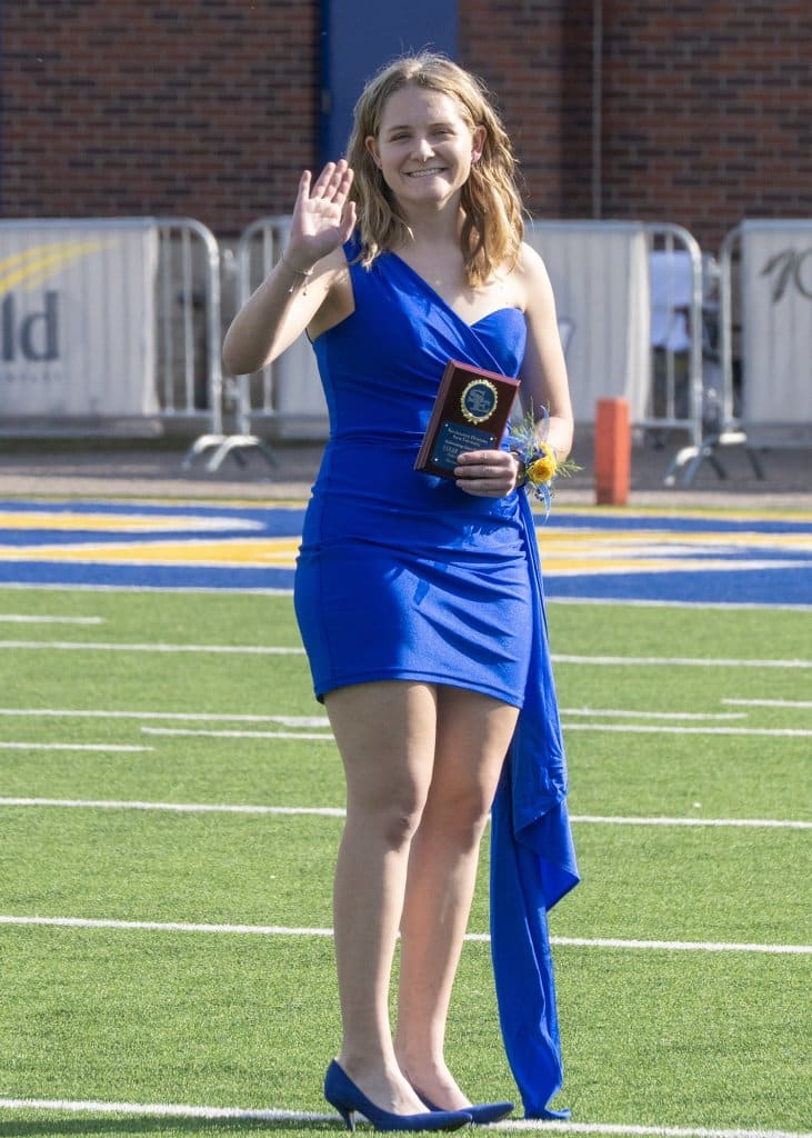 Sarah Coblentz eaves to the crowd as part of the Homecoming festivities