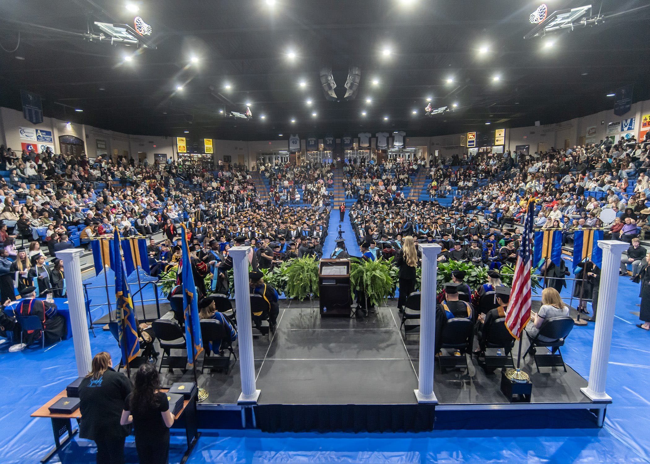 A large crowd from behind the stage at the 2025 fall commencement ceremonies