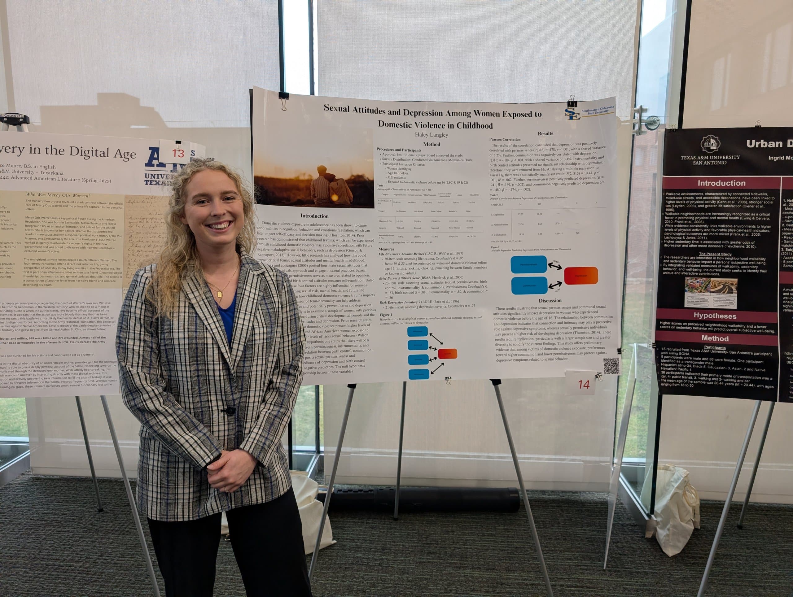 A woman standing in front of a research poster