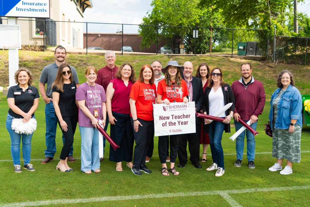 Katie Denton pictured with staff members receiving her award.
