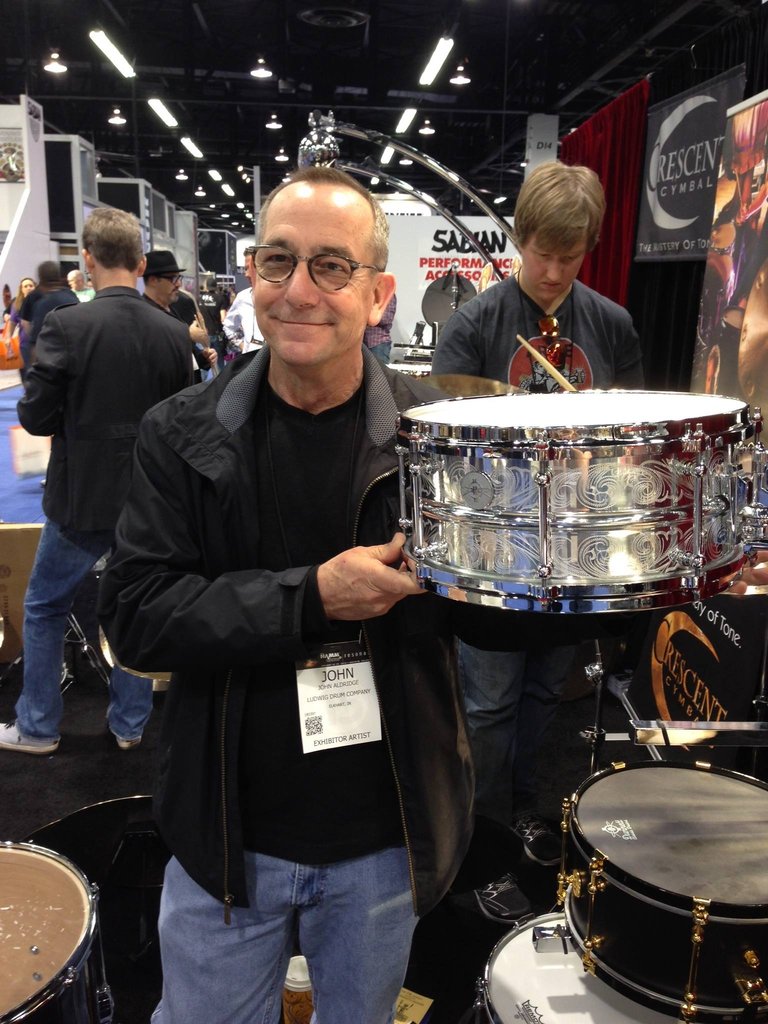 John Aldridge pictured with a custom engraved drum.