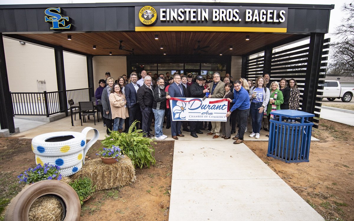 Ribbon-cutting held for Einsteins Bros. Bagels banner