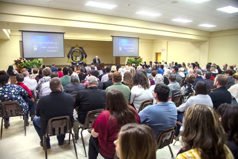 Justin Wilson offers remarks at Native American graduation event banner