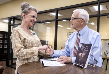 Robinson donates autographed copy of new book to Bennett Library Thumbnail