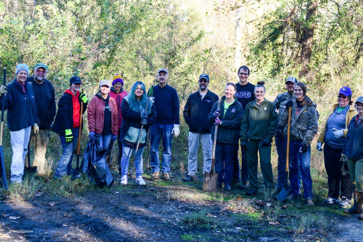 Southeastern pitches in to help with trash removal project banner