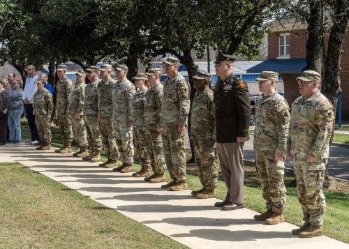 line-group-shot Military personnel in camouflage uniforms